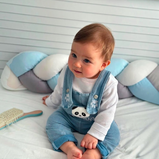 Baby boy wearing Panda Denim Dungaree Set sitting on bed