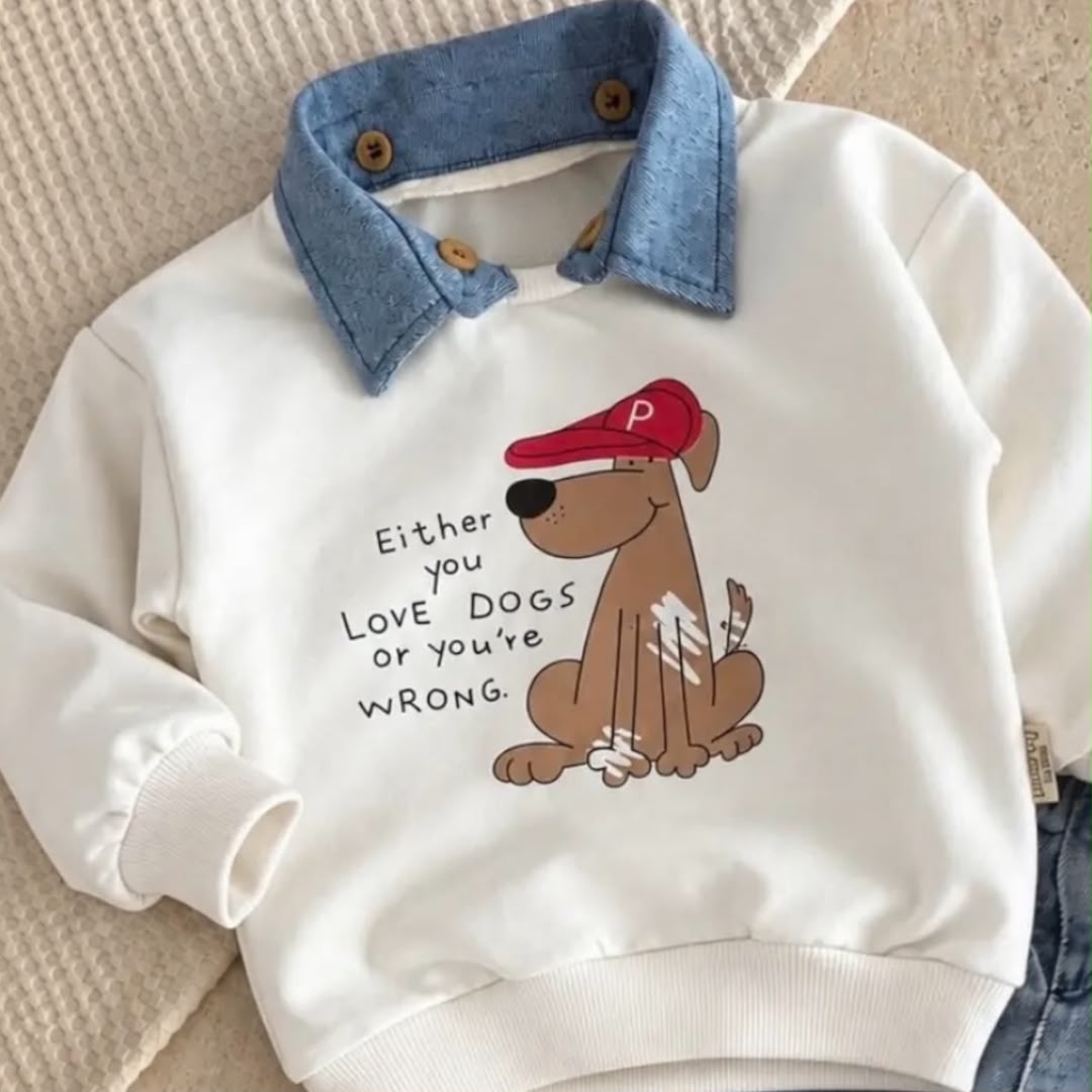 Close-up of dog graphic and blue collar on cream baby sweatshirt