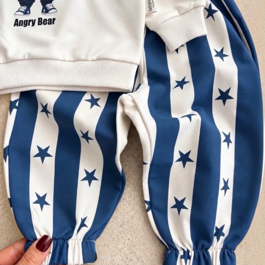 Navy and white striped baby joggers with star prints and elasticated ankle cuffs