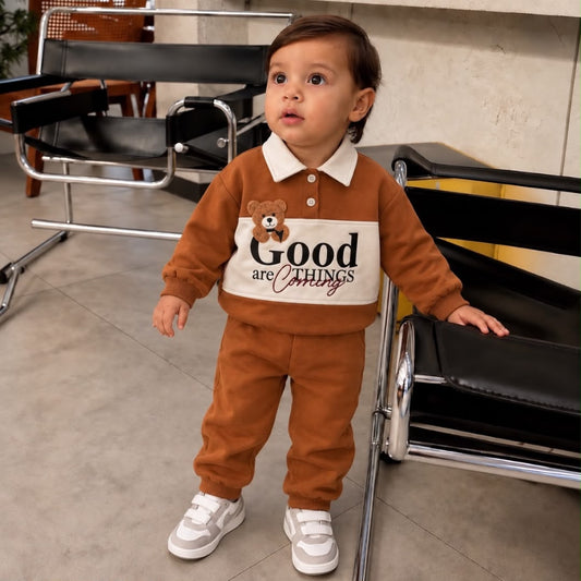 Toddler wearing rust-brown Good Things teddy bear collared sweatshirt and matching joggers