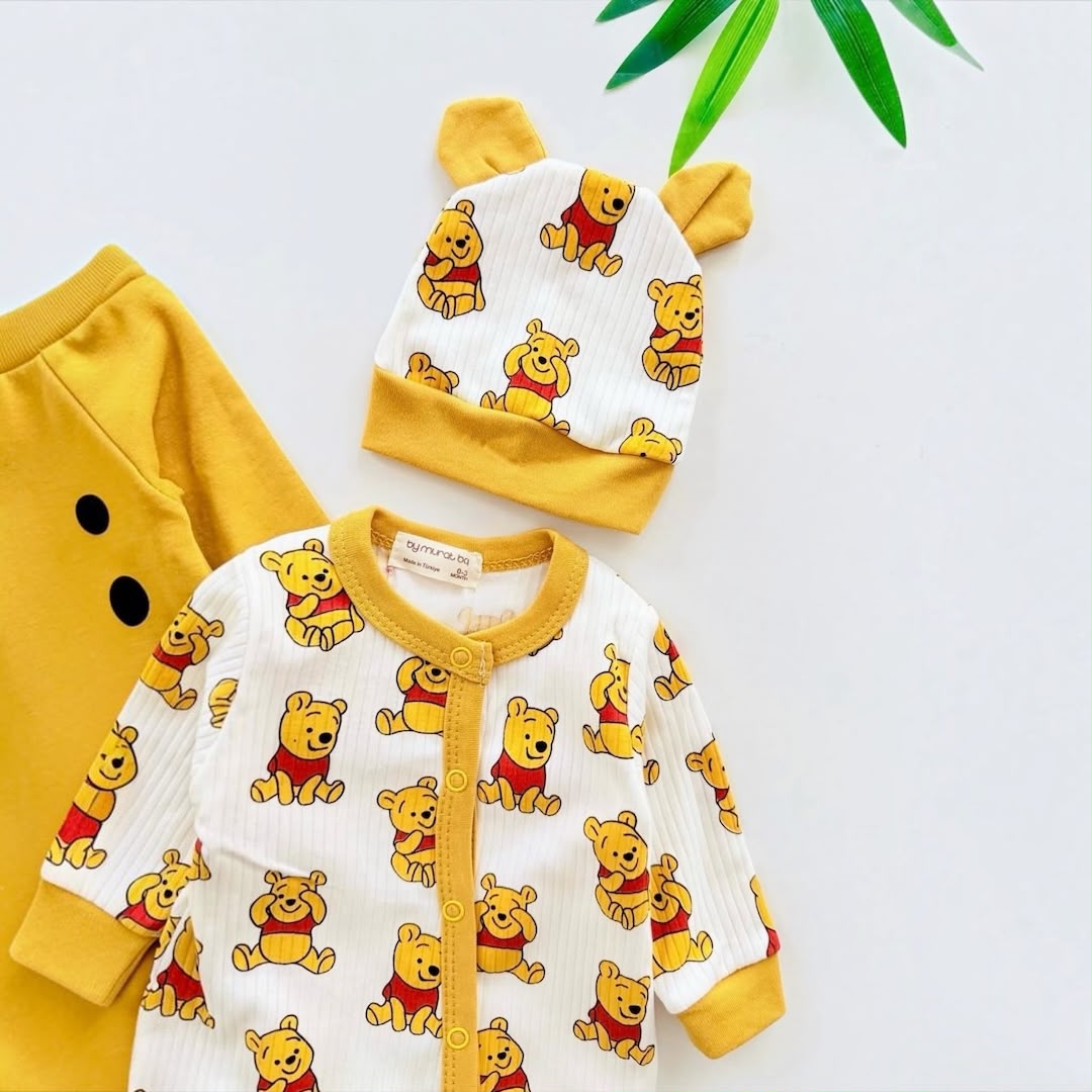 Baby Cartoon Bear Print White Romper & Bear Ear Hat Set flat lay with mustard trim