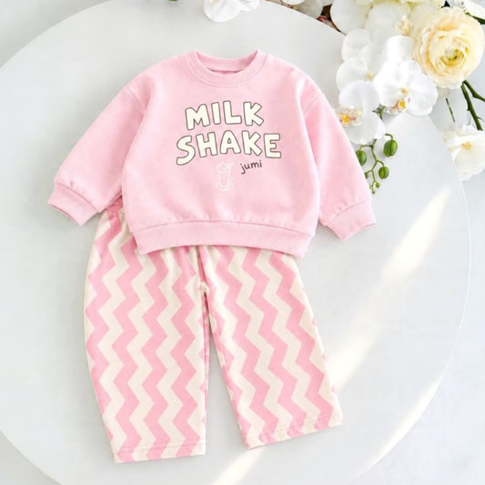 Pink Milk Shake baby sweatshirt with pink and cream chevron trousers laid flat