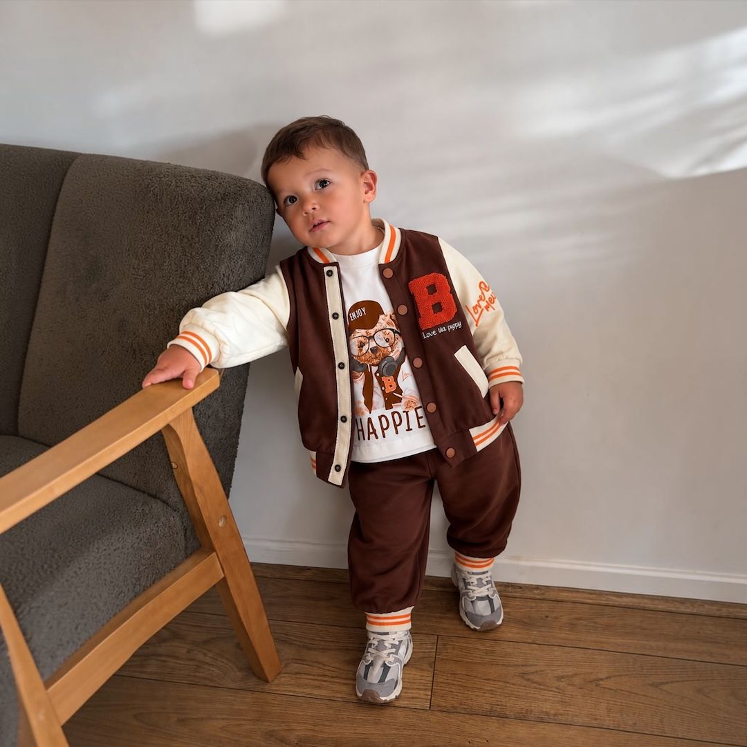 Baby boy wearing varsity bear set in chocolate brown