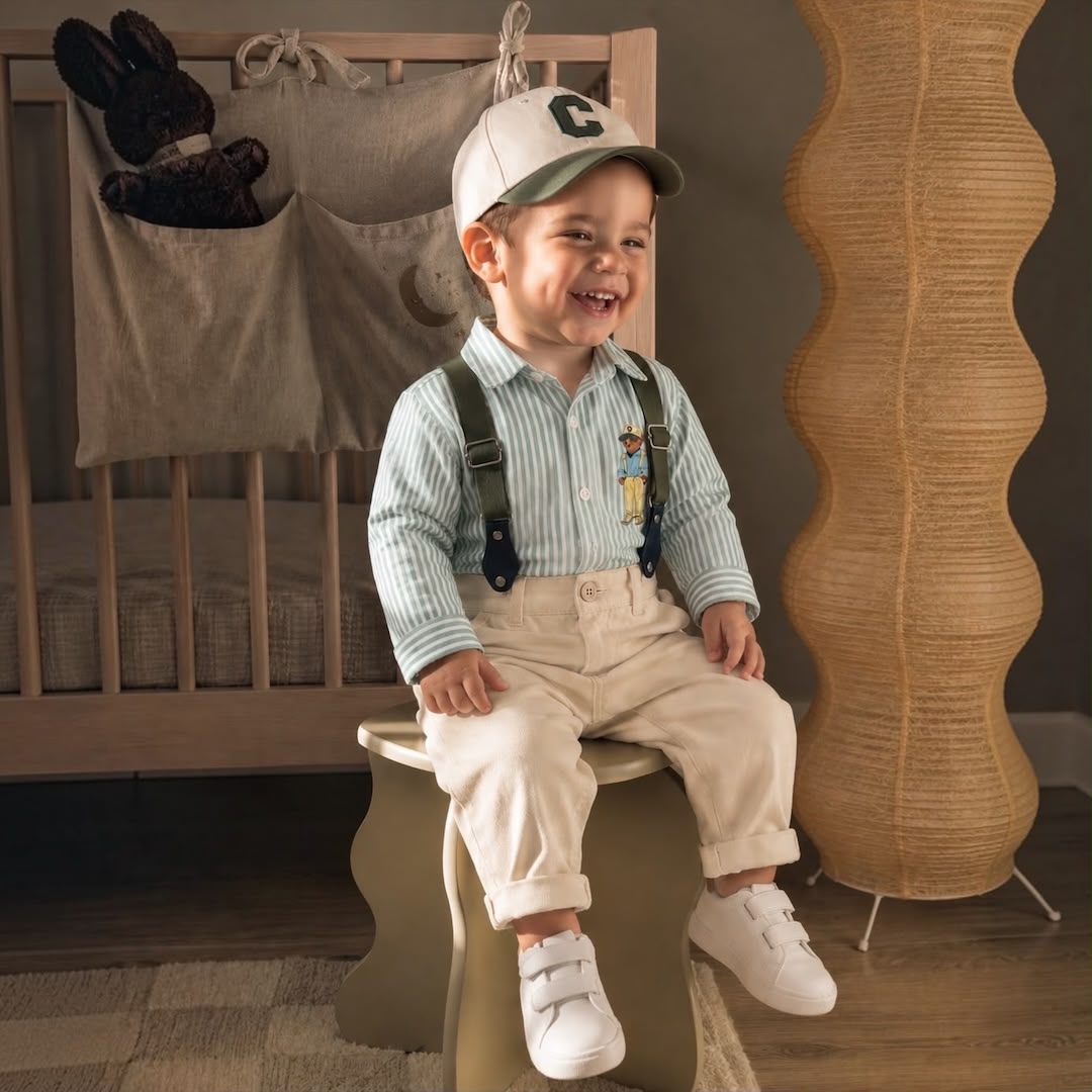Baby boy wearing Bear Stripe Green Set sitting laughing