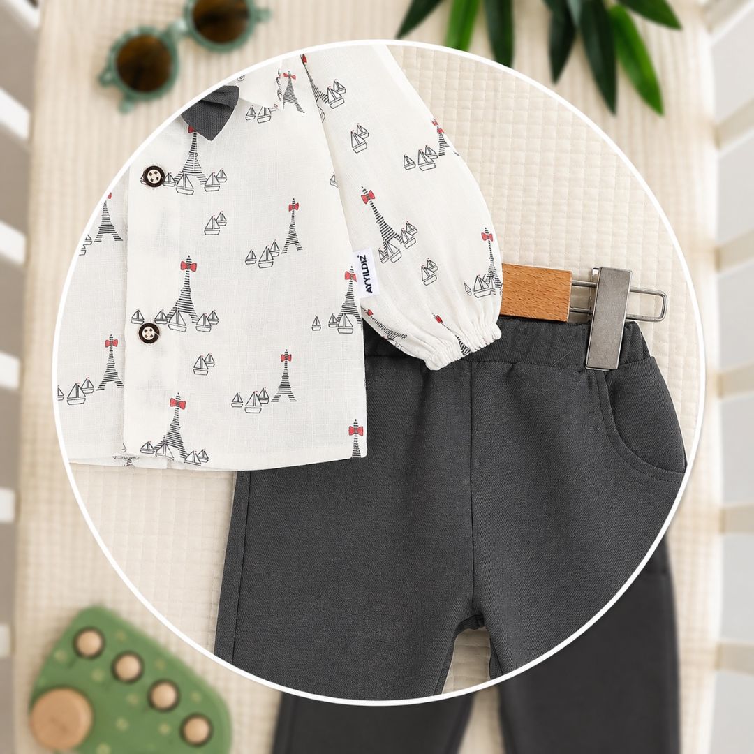 Close-up detail of landmark print shirt and charcoal trousers with belt