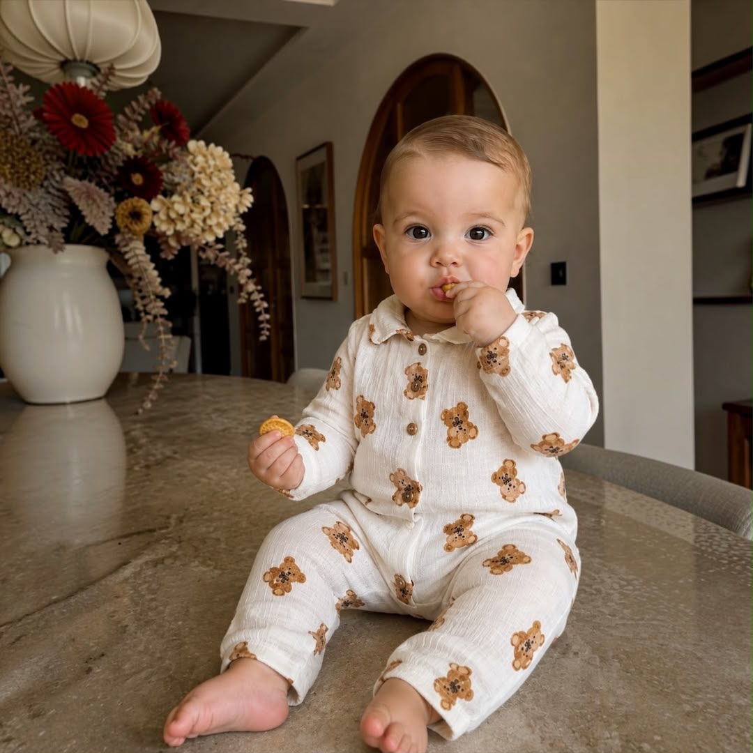Baby boy wearing Teddy Bear Muslin Romper sitting on marble counter