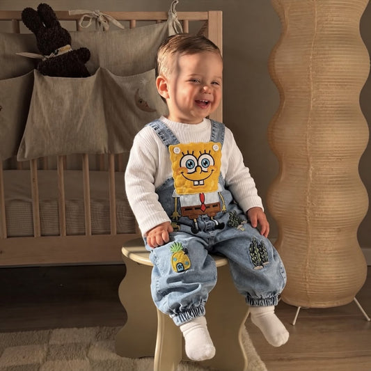 Baby boy wearing SpongeBob Denim Dungaree Set sitting laughing