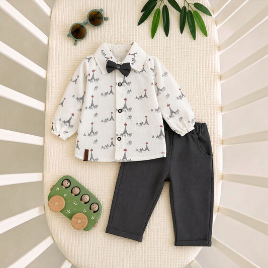Little gentleman baby set flat lay - printed shirt with bow tie and dark pants