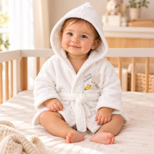 Toddler wearing white Little Friends hooded bathrobe