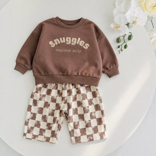 Baby two-piece set with brown sweatshirt and cream-and-brown checkered pants